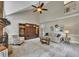 This is a cozy living room with a stone fireplace, tall ceilings, and neutral decor at 3004 High Vista Walk, Woodstock, GA 30189