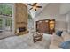 Spacious living room with stone fireplace, large windows, comfortable seating, and elegant decor at 3004 High Vista Walk, Woodstock, GA 30189