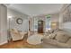 Cozy living room featuring hardwood floors, neutral tones, and comfortable seating at 3004 High Vista Walk, Woodstock, GA 30189