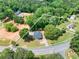 Aerial view of the property, situated on 1.2 acres of land with lush greenery at 7619 Campground Rd, Cumming, GA 30040