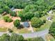 Property aerial view highlights 1.2 acres of land, a home and surrounding greenery at 7619 Campground Rd, Cumming, GA 30040