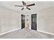Comfortable bedroom with soft carpeting, neutral decor, and natural light at 7619 Campground Rd, Cumming, GA 30040