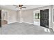 Cozy bedroom with gray carpet, neutral walls, and ample natural light at 7619 Campground Rd, Cumming, GA 30040