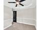 Bedroom featuring new carpet, ceiling fan, white trim, and black door at 7619 Campground Rd, Cumming, GA 30040