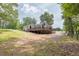 Inviting home featuring a well-maintained lawn, and manicured trees at 7619 Campground Rd, Cumming, GA 30040