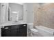Tiled bathroom featuring shower-tub, vanity and modern fixtures at 891 Proctor Oaks Nw St, Atlanta, GA 30318