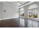 Spacious bedroom with hardwood floors, tray ceiling, and large windows at 891 Proctor Oaks Nw St, Atlanta, GA 30318
