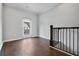 Spacious bonus room with hardwood floors and sliding door to balcony at 891 Proctor Oaks Nw St, Atlanta, GA 30318