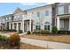 Beautiful townhouse with a balcony and well-manicured landscaping at 891 Proctor Oaks Nw St, Atlanta, GA 30318
