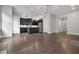 Open floor plan featuring kitchen with island, stainless steel appliances, and dark wood cabinets at 891 Proctor Oaks Nw St, Atlanta, GA 30318