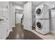 Convenient laundry room features a stacked washer and dryer unit at 891 Proctor Oaks Nw St, Atlanta, GA 30318
