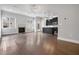 Open concept living area showcasing wood floors, fireplace, and kitchen with island at 891 Proctor Oaks Nw St, Atlanta, GA 30318