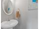 Cozy half bathroom featuring a white sink and mirror at 2280 Baker Station Dr, Acworth, GA 30101