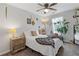 Bright bedroom with a ceiling fan, featuring hardwood floors and large windows at 2280 Baker Station Dr, Acworth, GA 30101
