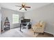 Bedroom featuring carpet flooring, a ceiling fan, and a window at 2280 Baker Station Dr, Acworth, GA 30101