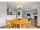 Bright and open dining room adjacent to the living room, featuring hardwood floors at 2280 Baker Station Dr, Acworth, GA 30101