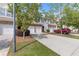 A lovely townhome with a two-car garage, brick features, and mature trees in a well-kept neighborhood at 2280 Baker Station Dr, Acworth, GA 30101