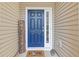 Charming blue front door with sidelight, 'Welcome' sign, and 'Home Sweet Home' doormat at 2280 Baker Station Dr, Acworth, GA 30101