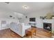 Comfortable living room featuring a fireplace, hardwood floors, and ample natural light at 2280 Baker Station Dr, Acworth, GA 30101