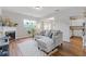Cozy living room with a fireplace, hardwood floors, and a comfortable sofa at 2280 Baker Station Dr, Acworth, GA 30101