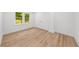Bright bedroom with hardwood floors, large window, and closet with bi-fold doors at 2385 Perkerson Sw Rd, Atlanta, GA 30315