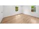 Bright bedroom with hardwood floors, a large window, and natural light at 2385 Perkerson Sw Rd, Atlanta, GA 30315