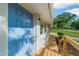 Freshly painted light blue front door with modern hardware and new porch railings at 2385 Perkerson Sw Rd, Atlanta, GA 30315