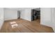 Open-concept living room with hardwood floors connecting to the kitchen at 2385 Perkerson Sw Rd, Atlanta, GA 30315