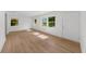 Bright living room with hardwood floors, large windows and recessed lighting at 2385 Perkerson Sw Rd, Atlanta, GA 30315