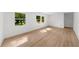 Sunlit living room with large windows and hardwood flooring for a bright space at 2385 Perkerson Sw Rd, Atlanta, GA 30315