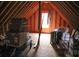 Spacious attic featuring wooden beams, ample storage space, and a window for natural light at 287 Diamond Ct, Carrollton, GA 30116