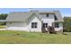Spacious backyard with a small deck and rear view of the home at 287 Diamond Ct, Carrollton, GA 30116