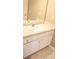 Bright bathroom featuring white vanity cabinets, a large mirror, and neutral flooring at 287 Diamond Ct, Carrollton, GA 30116
