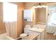Bathroom featuring a large mirror, toilet, bathtub, and ample storage space at 287 Diamond Ct, Carrollton, GA 30116