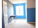 Bright bedroom featuring a chalkboard wall, a desk, and a large window at 287 Diamond Ct, Carrollton, GA 30116