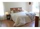 Cozy bedroom with a comfortable bed, warm lighting, and hardwood floors at 287 Diamond Ct, Carrollton, GA 30116