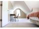 Slanted ceiling bedroom with a desk, chair, and bed, offering comfort at 287 Diamond Ct, Carrollton, GA 30116
