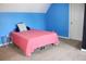 Bright bedroom featuring blue walls and a comfortable bed, offering a cozy ambiance at 287 Diamond Ct, Carrollton, GA 30116