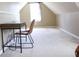 Cozy bedroom featuring neutral walls, carpet flooring, and desk with chair for study at 287 Diamond Ct, Carrollton, GA 30116