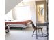 Slanted ceiling bedroom featuring a desk, chair, and bed, with adjoining bathroom entrance at 287 Diamond Ct, Carrollton, GA 30116