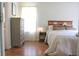 Comfortable bedroom features hardwood floors, warm lighting, and a chest of drawers at 287 Diamond Ct, Carrollton, GA 30116