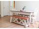 Cozy dining room features a wooden bench and chairs around a table setting with charming decor at 287 Diamond Ct, Carrollton, GA 30116