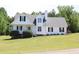 Charming two-story home with a well-manicured lawn and inviting front porch at 287 Diamond Ct, Carrollton, GA 30116