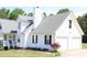 Bright two-car garage with white siding and a well-maintained lawn at 287 Diamond Ct, Carrollton, GA 30116