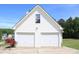 Spacious two-car garage with matching siding and a well-manicured lawn at 287 Diamond Ct, Carrollton, GA 30116
