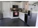 Bright kitchen with white cabinets, stainless steel refrigerator, and modern appliances at 287 Diamond Ct, Carrollton, GA 30116