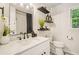 Contemporary bathroom features modern fixtures, floating shelves, and a stylish mirror and vanity at 2987 Windward Nw Dr, Kennesaw, GA 30152