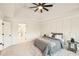 Bedroom features a tray ceiling, a ceiling fan, and two windows at 2987 Windward Nw Dr, Kennesaw, GA 30152