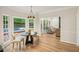 Sunny breakfast nook with views of the pool area, comfortable seating, and hardwood floors at 2987 Windward Nw Dr, Kennesaw, GA 30152