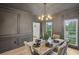Dining room features a marble table, and wainscoting with modern lighting at 2987 Windward Nw Dr, Kennesaw, GA 30152